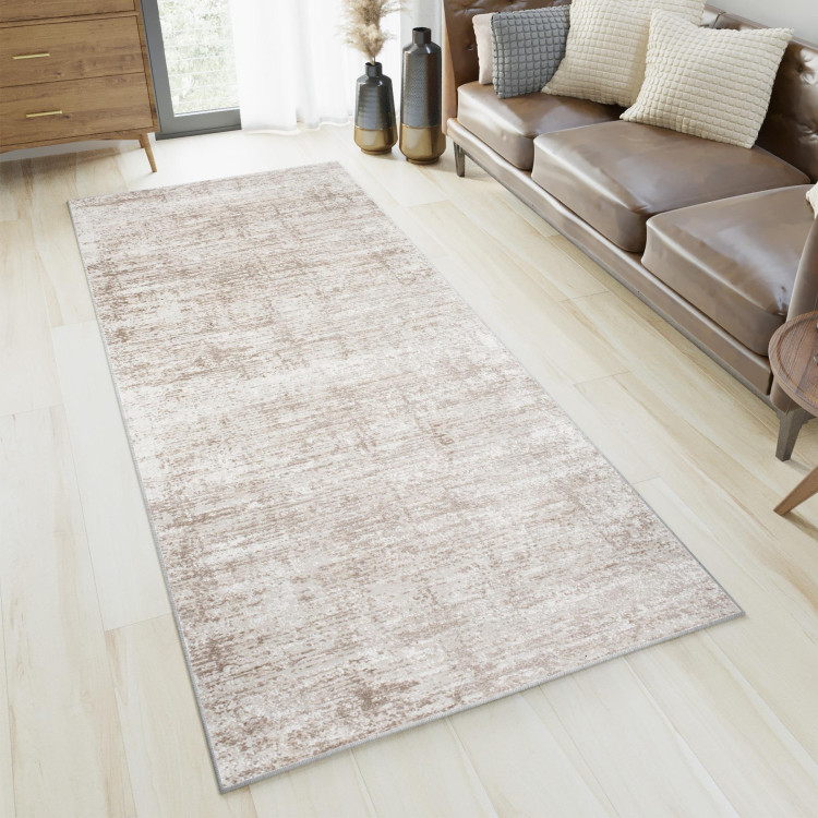 Preproga z nežnim vzorcem v krem barvi