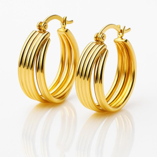 Ženski okrogli pozlačeni uhani