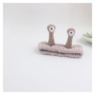 Plišasti naglavni trak v sivi barvi s polžem