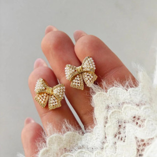 Ženski uhani v obliki pentlje z biseri