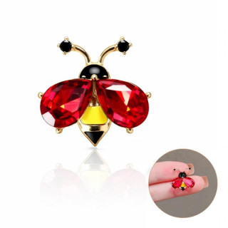 Broška v obliki rdeče žuželke