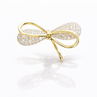 Zlata broška v obliki pentlje s cirkoni