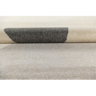 Krem preproga z abstraktnimi vzorci