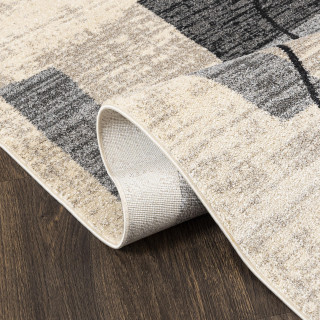 Krem preproga z abstraktnimi vzorci