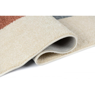 Krem preproga z abstraktnimi vzorci