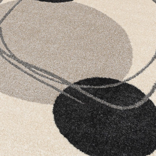 Krem preproga z abstraktnimi vzorci