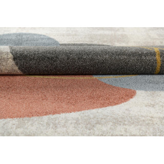 Krem preproga z abstraktnimi vzorci