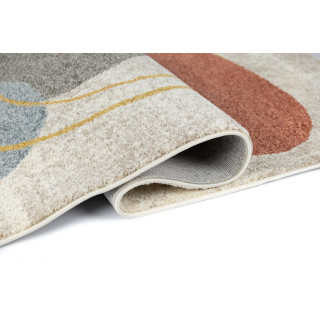 Krem preproga z abstraktnimi vzorci