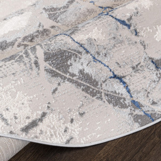 Vzorčasta okrogla preproga v modro-sivi barvi