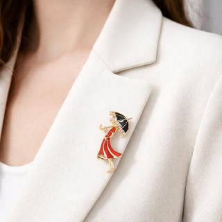 Broška v obliki ženske z dežnikom